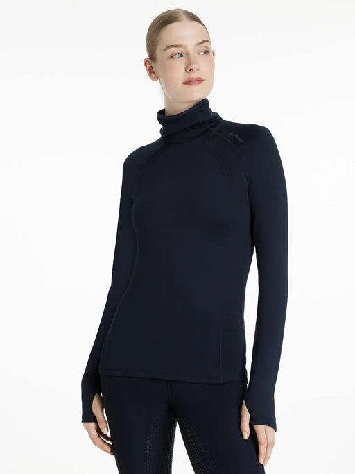 Woman wearing a navy blue long-sleeve top with a high collar
