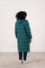 Person wearing a teal puffer coat 
